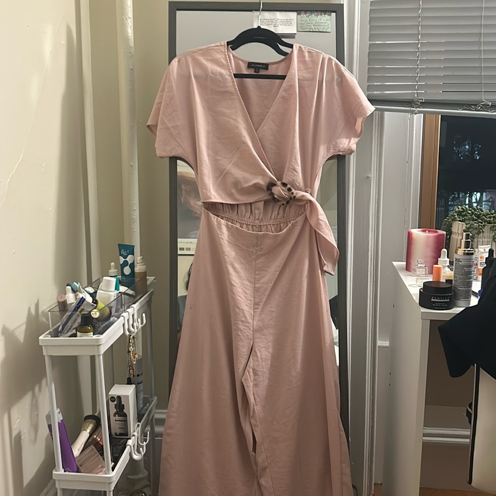 Light pink jumpsuit with midsection cutout!